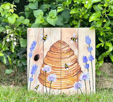 Liz Corley Art wooden wall art featuring a hand painted beehive, lavender, corn flowers and hovering honey bees.