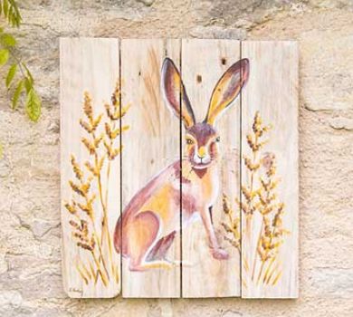 Wooden wall art hand painted with a hare by Liz Corley Art